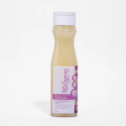 A plastic bottle of Shampoo De Cebolla with a white cap and purple label featuring text and floral graphics, set against a plain white background.